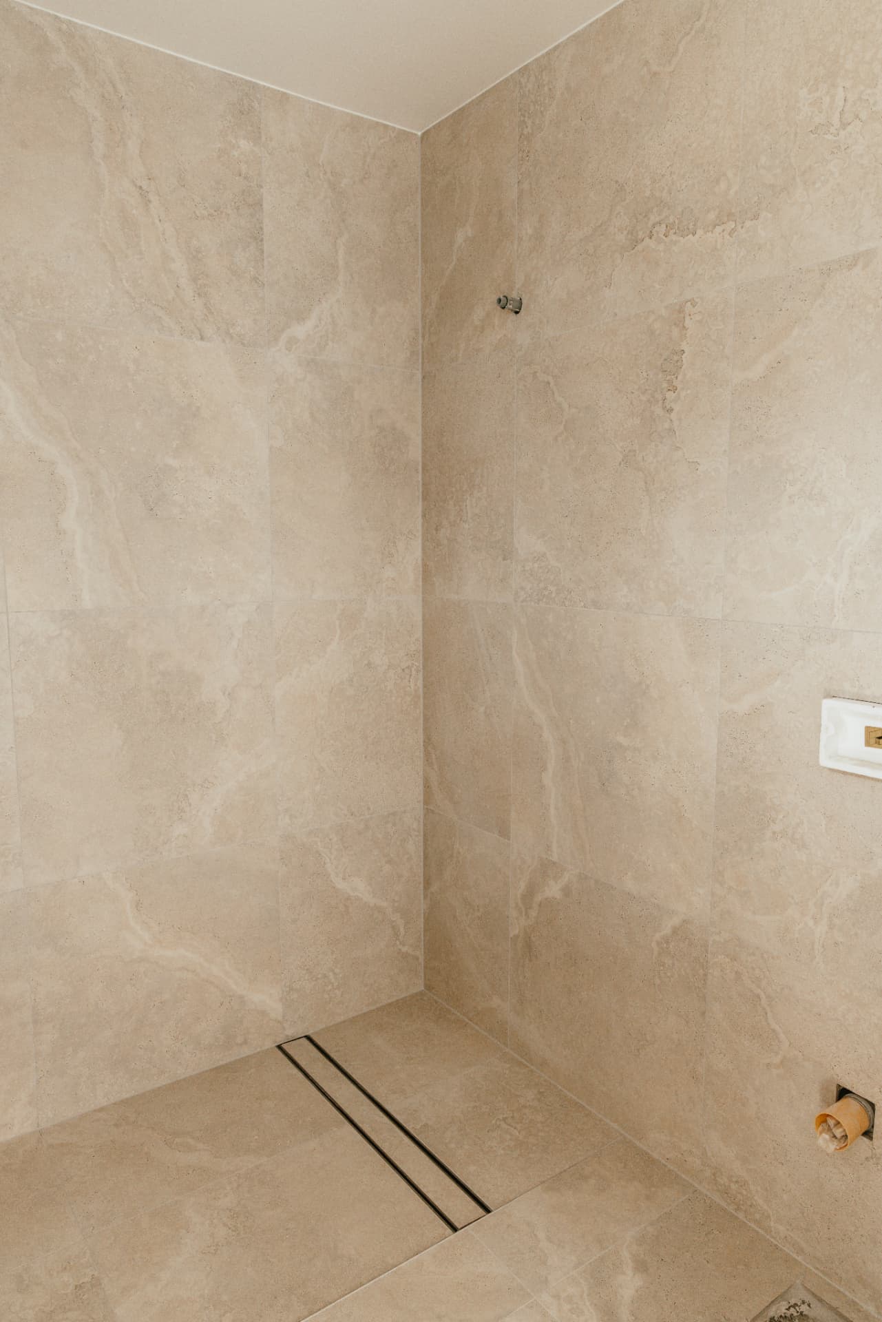 Travertine-look shower, tiling by Level Up, Gold Coast