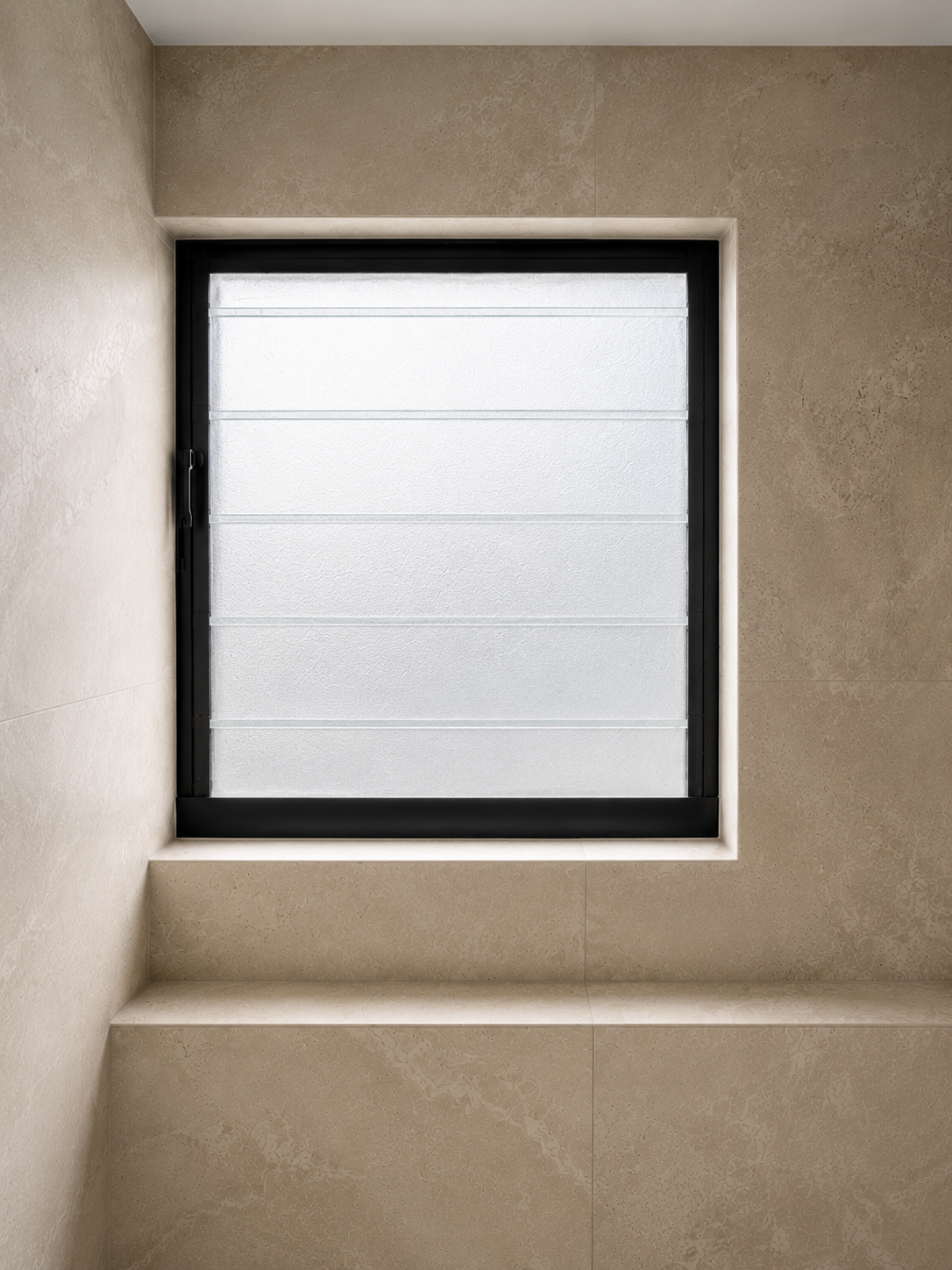 Tiled wall and window reveal finished with a clean square edge